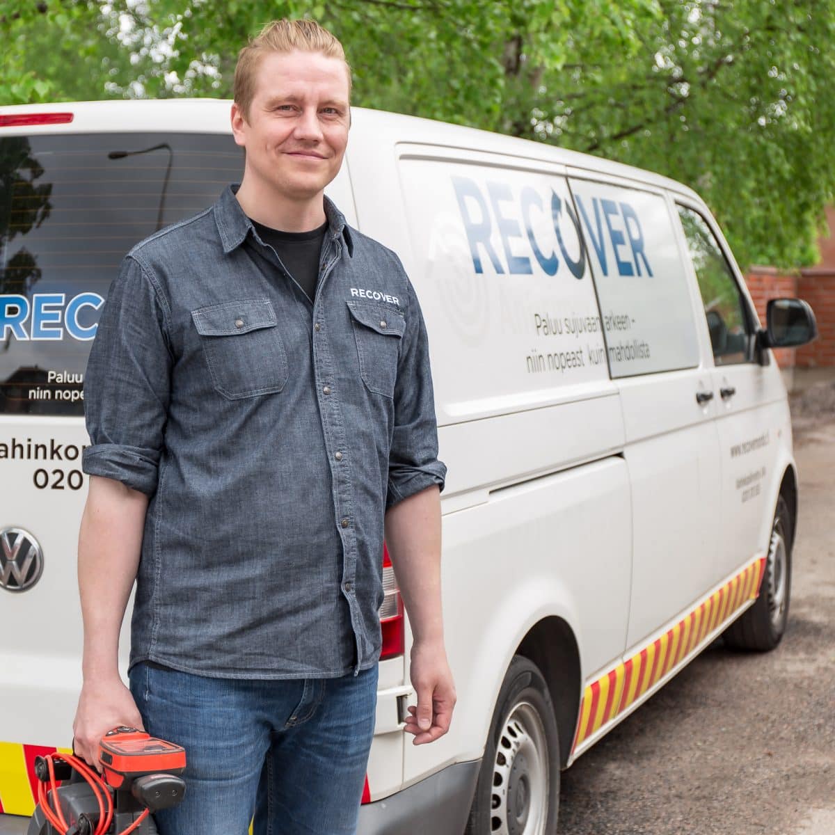 Technical worker in from of van