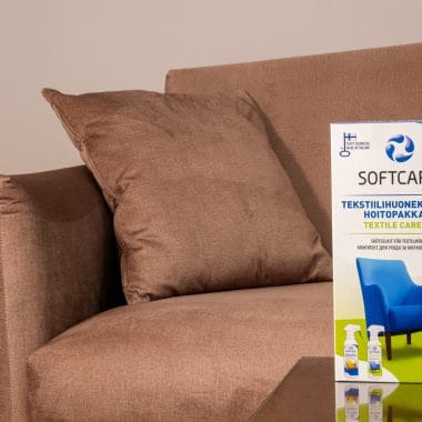 Textile cleaning product package in front of the sofa