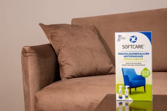 Textile cleaning product package in front of the sofa