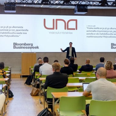 Famous speaker giving a presentation at the conference in front of large audience