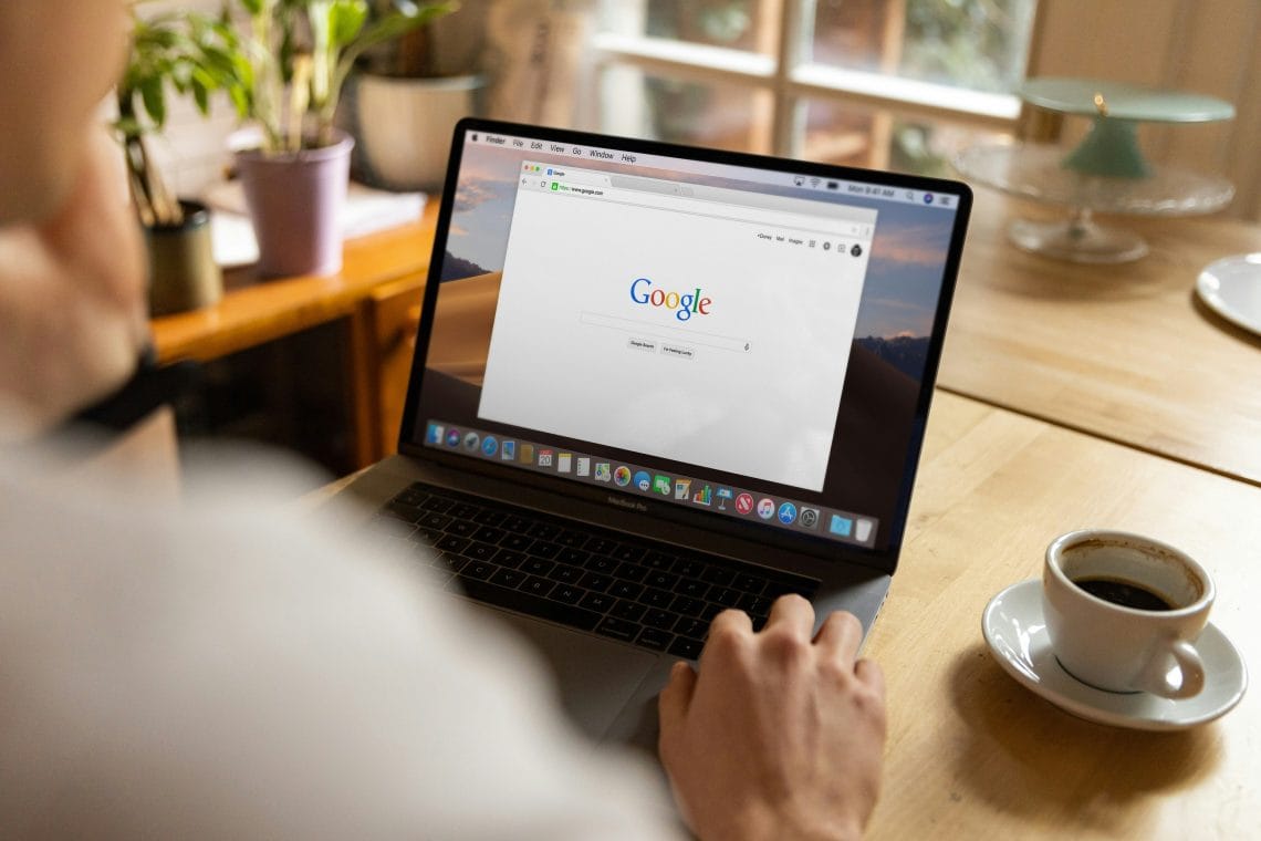Person using Google search on laptop